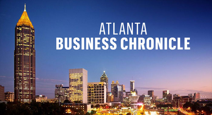 Atlanta Business Chronicle Logo with City in Background