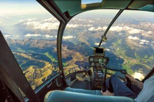 Pilot flying over picturesque terrain