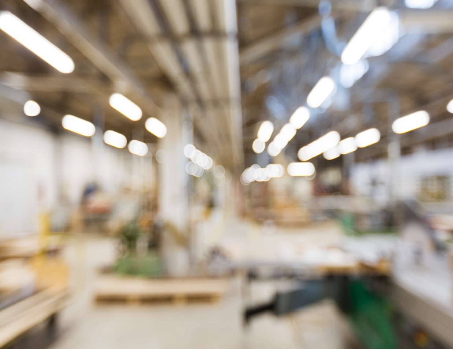 blurred image of a factory floor, representing the fuzzy supply chain