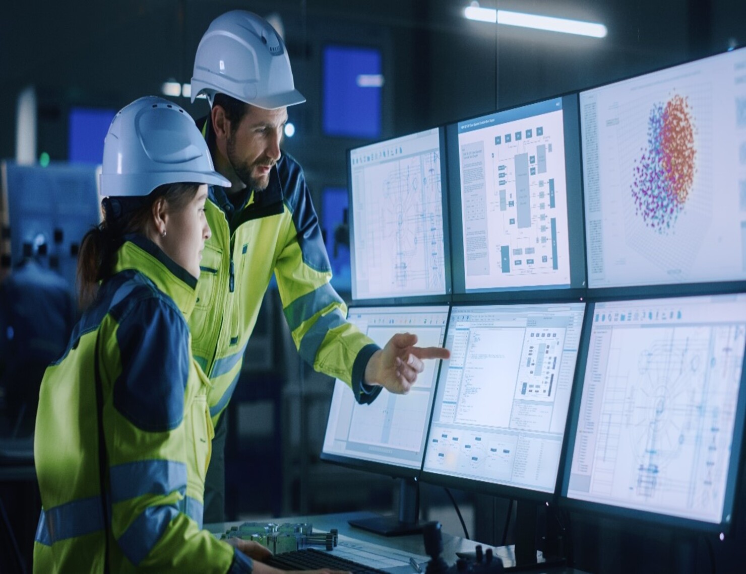 hardhat workers in front of computer screens, using process mining to map their value streams