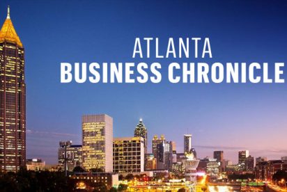 Atlanta Business Chronicle Logo with City in Background