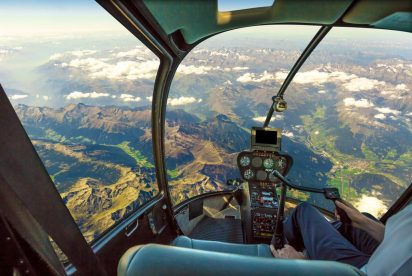 Pilot flying over picturesque terrain
