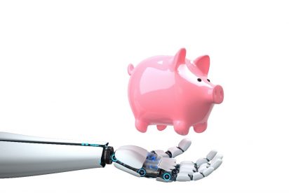 A robotic hand holding a pink piggy bank against a white background.