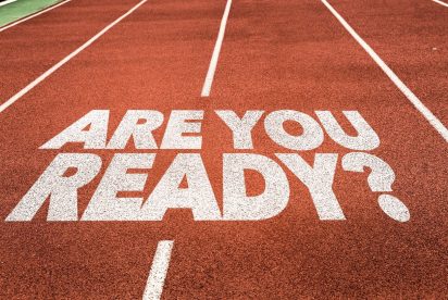 Track lanes with "ARE YOU READY?" written in bold white letters on the red surface.